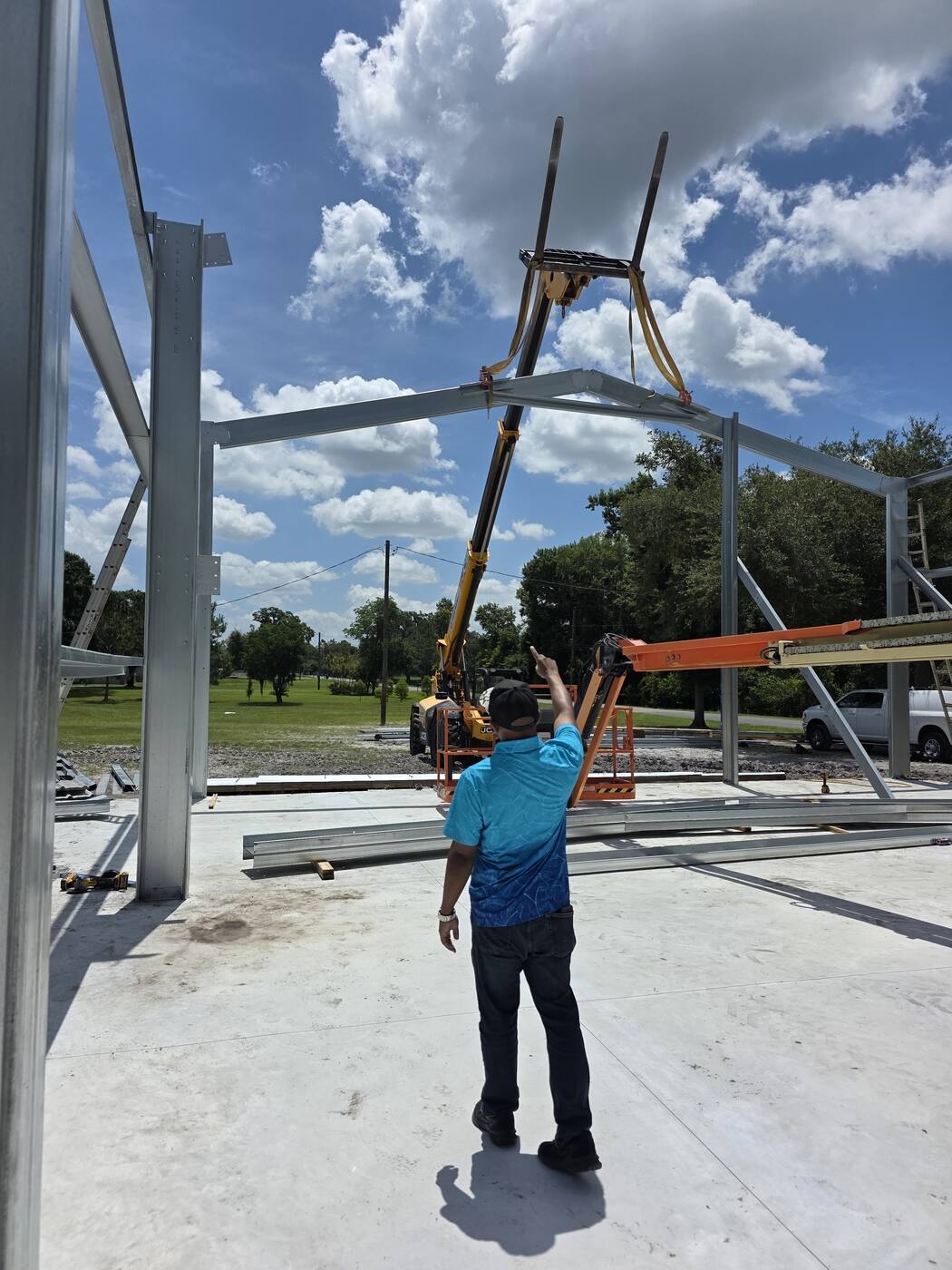 Crew setting the steel frame