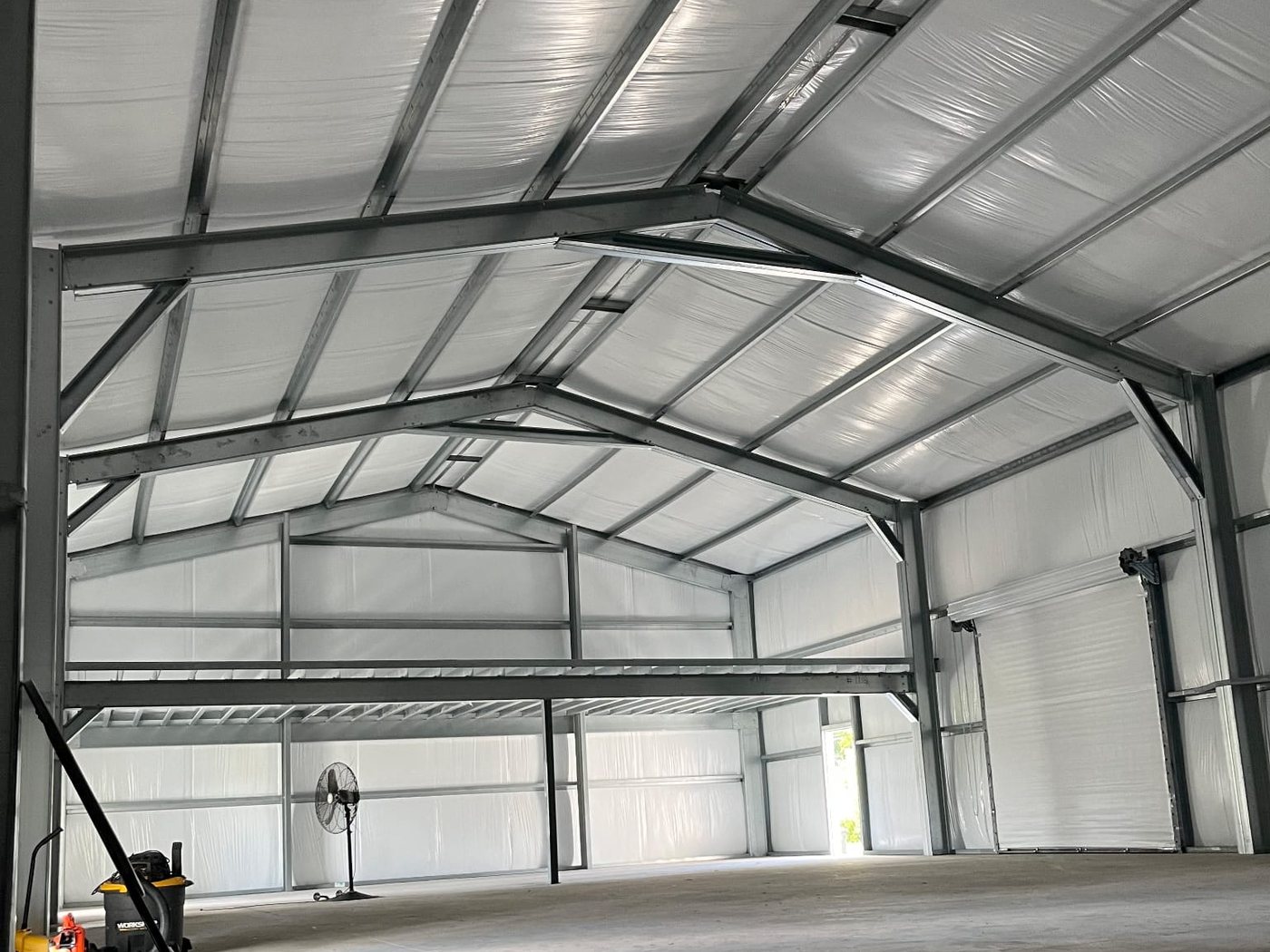 Clear-span steel interior with mezzanine